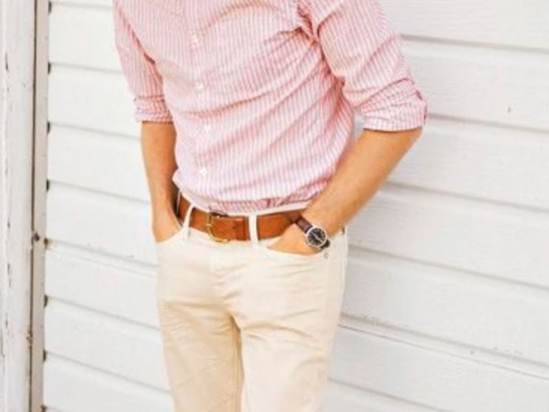 Man wearing khaki pants with a brown leather belt