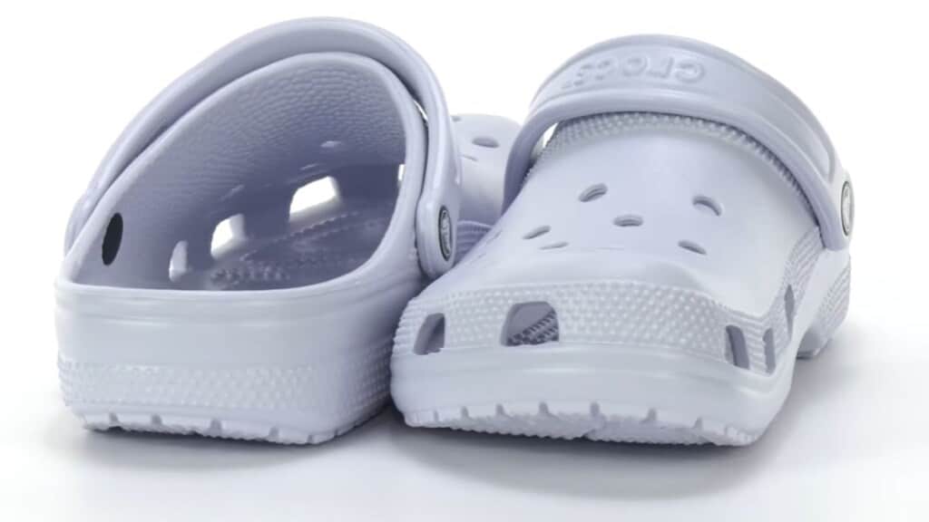 A pair of white Crocs shoes placed side by side, illustrating the topic Do Crocs run big or small and helping users choose the right Crocs shoe size.