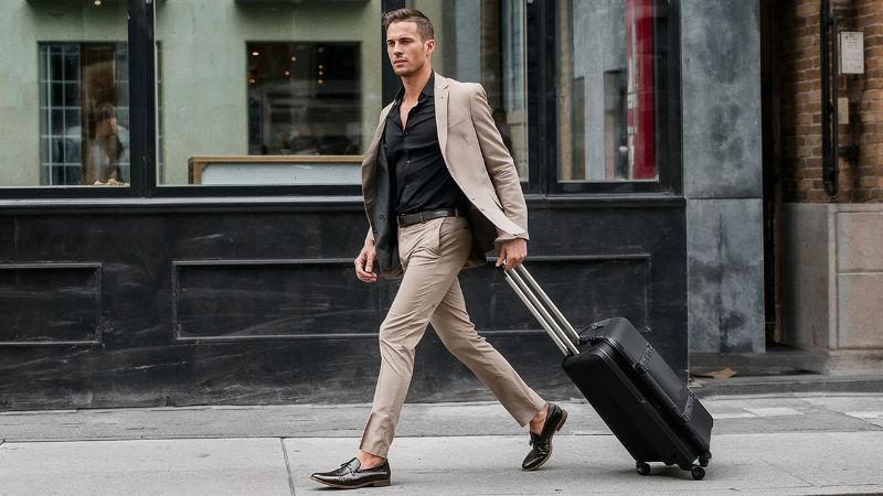 What Color Dress Shirts Go with Khaki Pants? 2 Man wearing black shirt with khaki pants and blazer smart casual men outfit
