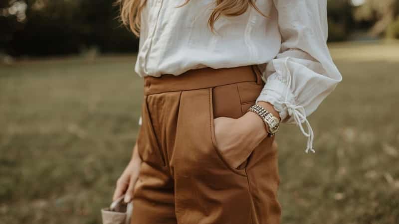 Brown pants styled with a white blouse for women