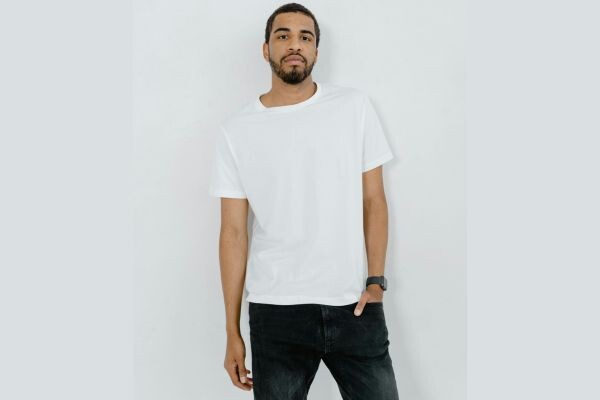 Best men’s white t-shirt – Everlane Premium-Weight Crew on male model showcasing classic fit and premium cotton fabric.