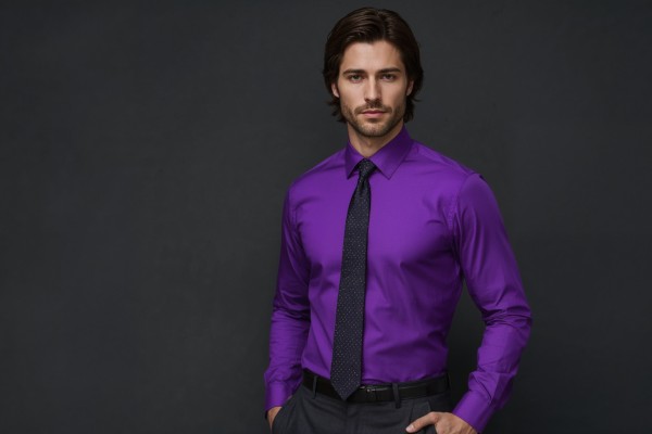 Purple dress shirt paired with a matching purple tie for a sleek monochrome men’s formal outfit
